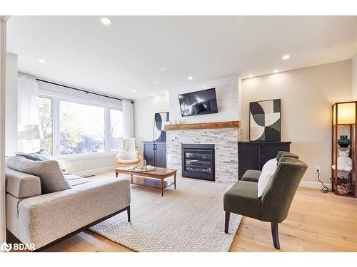 64 Bradley Boulevard, Mitchell'S Corners, ON - Indoor Photo Showing Living Room With Fireplace