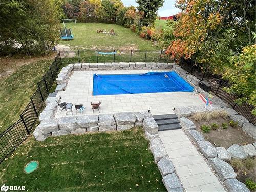 64 Bradley Boulevard, Mitchell'S Corners, ON - Outdoor With In Ground Pool With Backyard