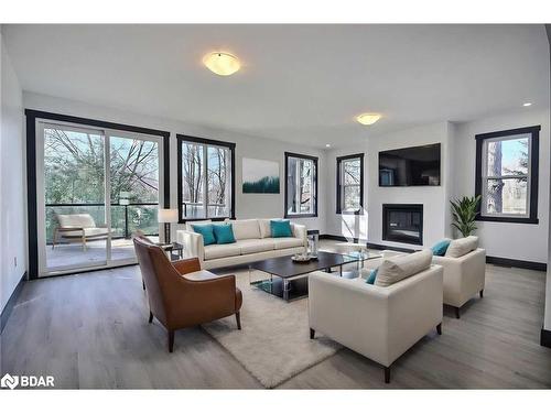 A-23 Gray Street, Coldwater, ON - Indoor Photo Showing Living Room With Fireplace