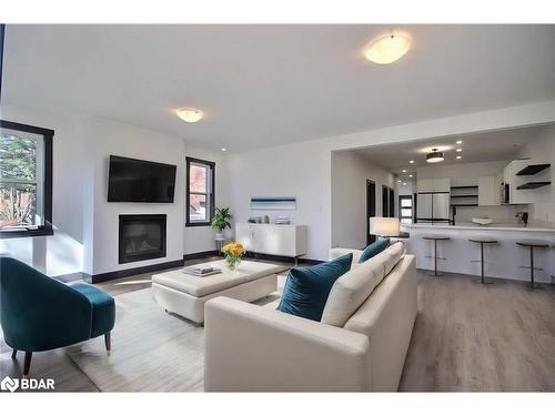 A-23 Gray Street, Coldwater, ON - Indoor Photo Showing Living Room With Fireplace