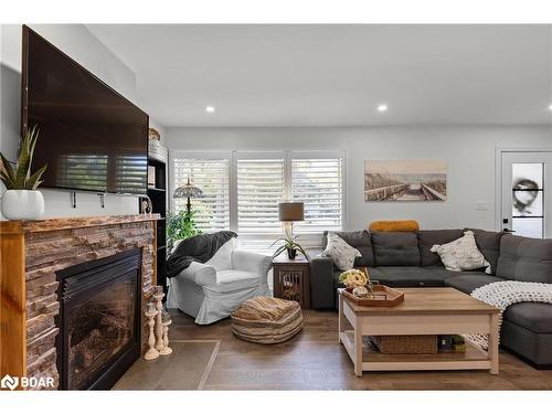 1551 Gill Road, Midhurst, ON - Indoor Photo Showing Living Room With Fireplace