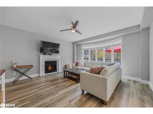 21 Moreau Way, Springwater, ON - Indoor Photo Showing Living Room With Fireplace