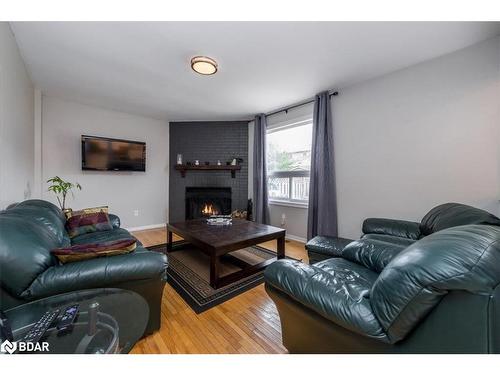 9 Cuthbert Street, Barrie, ON - Indoor Photo Showing Living Room With Fireplace