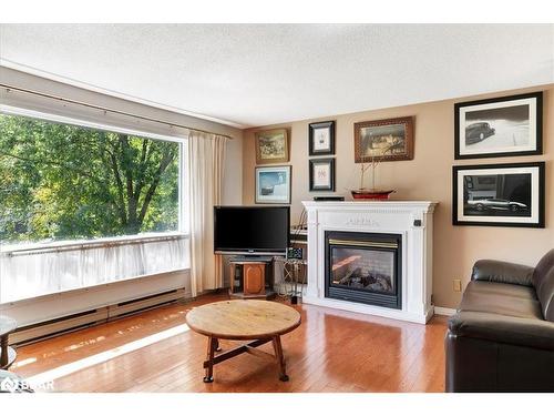 65 Meadow Heights Drive, Bracebridge, ON - Indoor Photo Showing Living Room With Fireplace