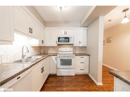 212-10 Coulter Street, Barrie, ON - Indoor Photo Showing Kitchen With Double Sink