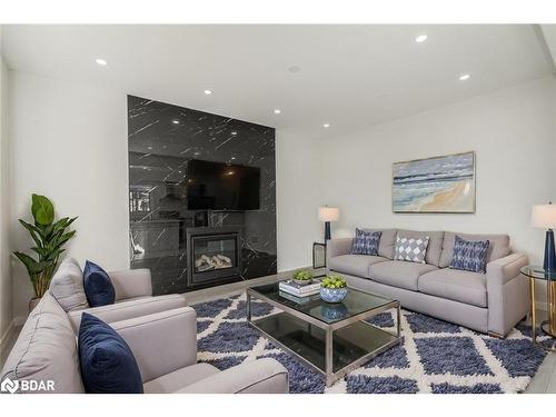 28 Sanford Circle, Springwater, ON - Indoor Photo Showing Living Room With Fireplace