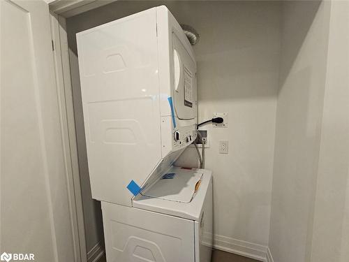 Basement-63 Victoria Wood Avenue, Springwater, ON - Indoor Photo Showing Laundry Room