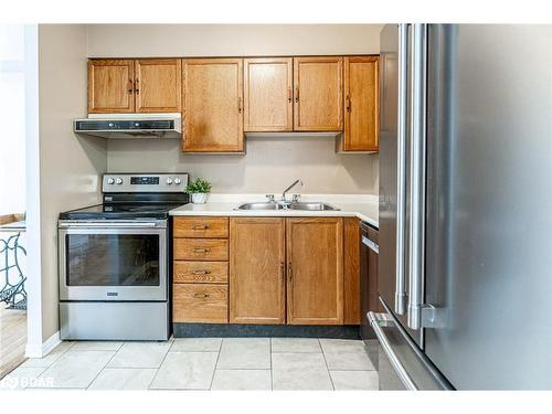 301-1047 Mississaga Street West, Orillia, ON - Indoor Photo Showing Kitchen With Stainless Steel Kitchen With Double Sink