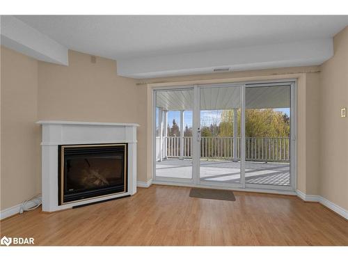 5-30 Mulligan Lane, Wasaga Beach, ON - Indoor Photo Showing Living Room With Fireplace