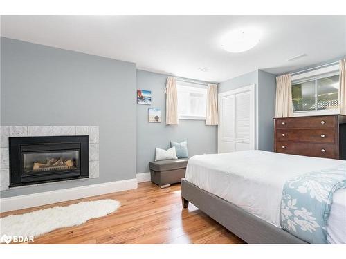 795744 Grey Road 19, The Blue Mountains, ON - Indoor Photo Showing Bedroom With Fireplace