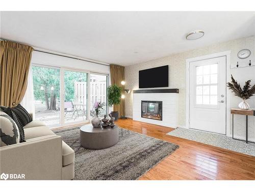 104-23 Dawson Drive, Collingwood, ON - Indoor Photo Showing Living Room With Fireplace