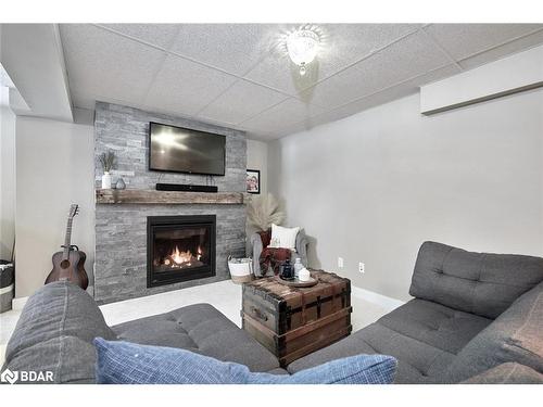 6394 Bluebird Street, Ramara, ON - Indoor Photo Showing Living Room With Fireplace