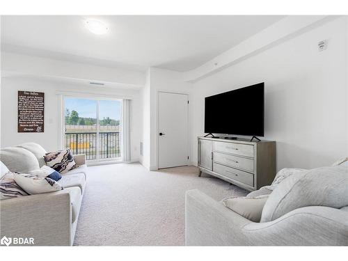 302-6 Spice Way, Barrie, ON - Indoor Photo Showing Living Room