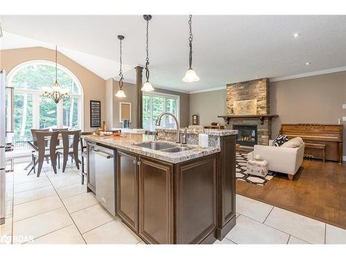 16 Boothby Crescent, Minesing, ON - Indoor Photo Showing Kitchen With Fireplace With Double Sink