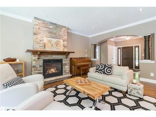 16 Boothby Crescent, Minesing, ON - Indoor Photo Showing Living Room With Fireplace