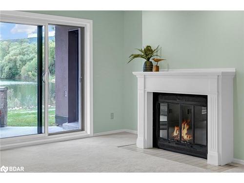 14-54 Blue Springs Drive, Waterloo, ON - Indoor Photo Showing Living Room With Fireplace