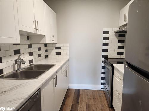 212-8800 Willoughby Drive, Niagara Falls, ON - Indoor Photo Showing Kitchen With Double Sink