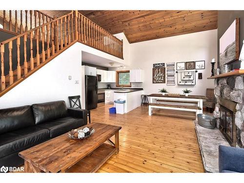 1046 Pine Springs Road, Algonquin Highlands, ON - Indoor Photo Showing Living Room With Fireplace