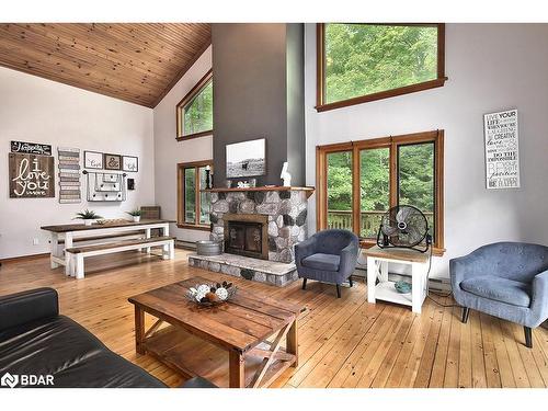 1046 Pine Springs Road, Algonquin Highlands, ON - Indoor Photo Showing Living Room With Fireplace