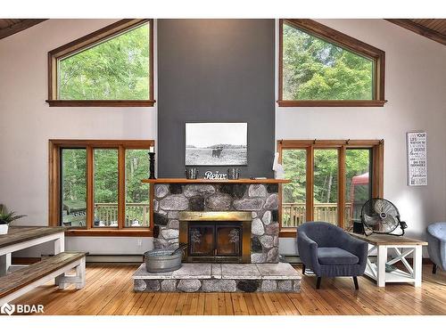 1046 Pine Springs Road, Algonquin Highlands, ON - Indoor Photo Showing Living Room With Fireplace