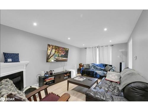 Upper-241 Letitia Street, Barrie, ON - Indoor Photo Showing Living Room With Fireplace