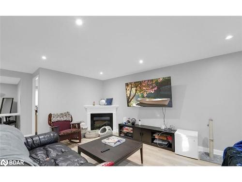 Upper-241 Letitia Street, Barrie, ON - Indoor Photo Showing Living Room With Fireplace