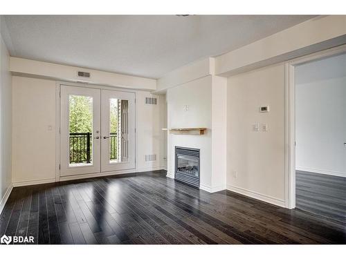 206-6 Brandy Lane Drive, Collingwood, ON - Indoor Photo Showing Living Room With Fireplace