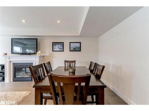 61 Quinn Forest Drive, Bracebridge, ON - Indoor Photo Showing Dining Room With Fireplace