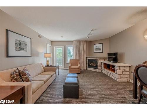 2220-2221-90 Highland Drive, Oro-Medonte, ON - Indoor Photo Showing Living Room With Fireplace