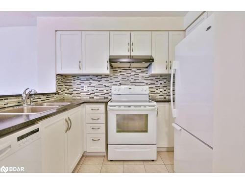 908-140 Dunlop Street E, Barrie, ON - Indoor Photo Showing Kitchen With Double Sink