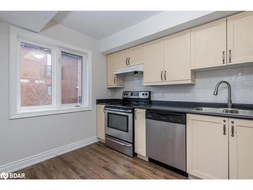 4-35 Madelaine Drive, Barrie, ON - Indoor Photo Showing Kitchen With Double Sink