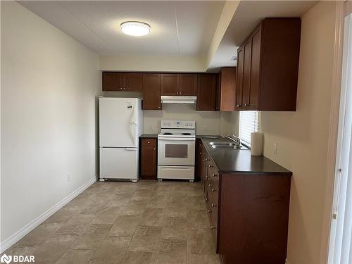 101-496 Yonge Street, Barrie, ON - Indoor Photo Showing Kitchen With Double Sink