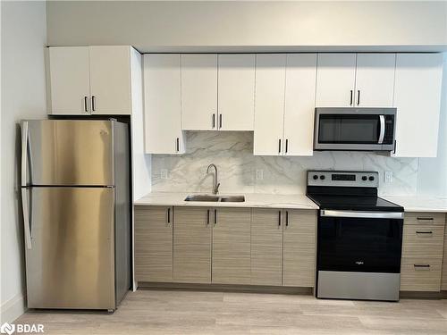 106-75 Barrie Road, Orillia, ON - Indoor Photo Showing Kitchen With Stainless Steel Kitchen With Double Sink