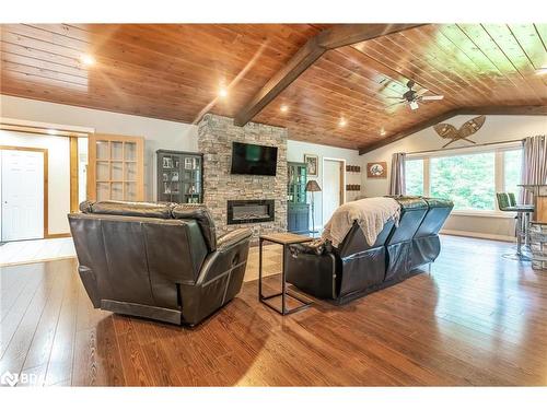 328 Peek-A-Boo Trail, Tiny, ON - Indoor Photo Showing Living Room With Fireplace