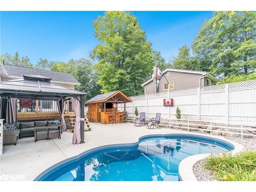 328 Peek-A-Boo Trail, Tiny, ON - Outdoor With In Ground Pool With Deck Patio Veranda