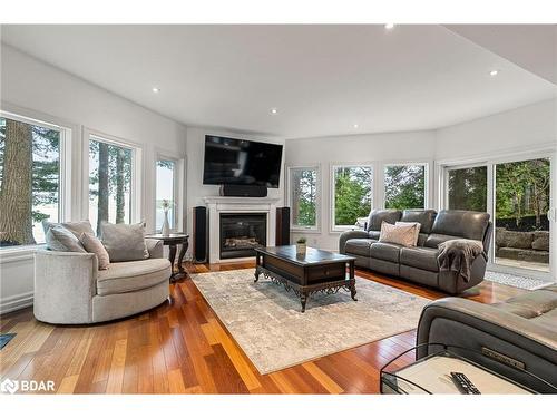 2240 South Orr Lake Road, Elmvale, ON - Indoor Photo Showing Living Room With Fireplace