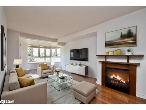 304-16 Raglan Street, Collingwood, ON - Indoor Photo Showing Living Room With Fireplace