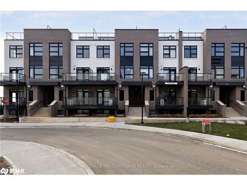 108-1565 Rose Way, Milton, ON - Outdoor With Balcony With Facade