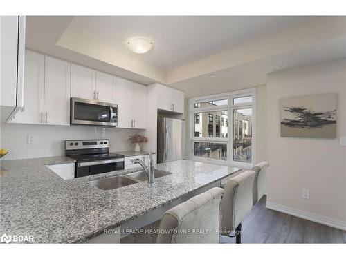 108-1565 Rose Way, Milton, ON - Indoor Photo Showing Kitchen With Stainless Steel Kitchen With Double Sink With Upgraded Kitchen