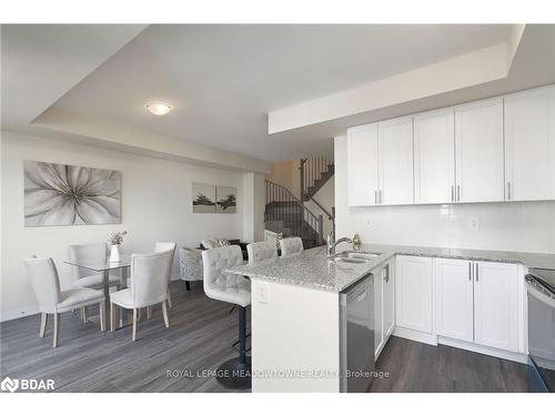 108-1565 Rose Way, Milton, ON - Indoor Photo Showing Kitchen With Double Sink