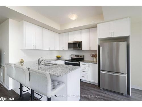 108-1565 Rose Way, Milton, ON - Indoor Photo Showing Kitchen With Stainless Steel Kitchen With Double Sink