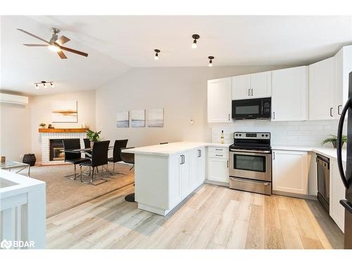 403-12 Dawson Drive, Collingwood, ON - Indoor Photo Showing Kitchen With Fireplace