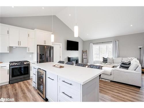 27 Leisure Court, Coldwater, ON - Indoor Photo Showing Other Room With Fireplace