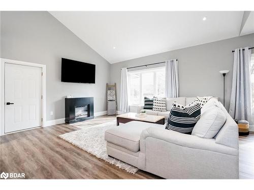 27 Leisure Court, Coldwater, ON - Indoor Photo Showing Living Room With Fireplace