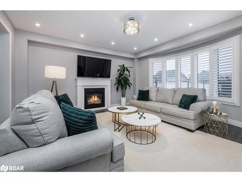 19 Rugman Crescent, Springwater, ON - Indoor Photo Showing Living Room With Fireplace