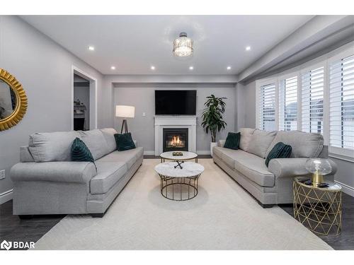 19 Rugman Crescent, Springwater, ON - Indoor Photo Showing Living Room With Fireplace