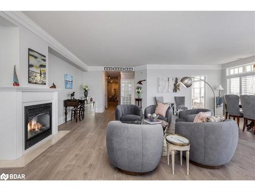 401-140 Cedar Island Road, Orillia, ON - Indoor Photo Showing Living Room With Fireplace