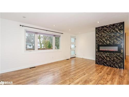 2427 Wallace Avenue, Innisfil, ON - Indoor Photo Showing Living Room With Fireplace