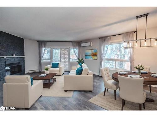 303-131 Clapperton Street, Barrie, ON - Indoor Photo Showing Living Room With Fireplace