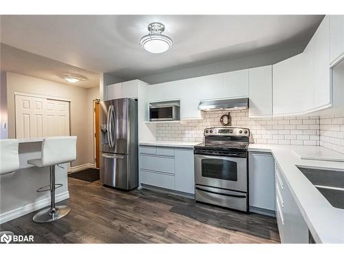 303-131 Clapperton Street, Barrie, ON - Indoor Photo Showing Kitchen With Stainless Steel Kitchen With Double Sink With Upgraded Kitchen